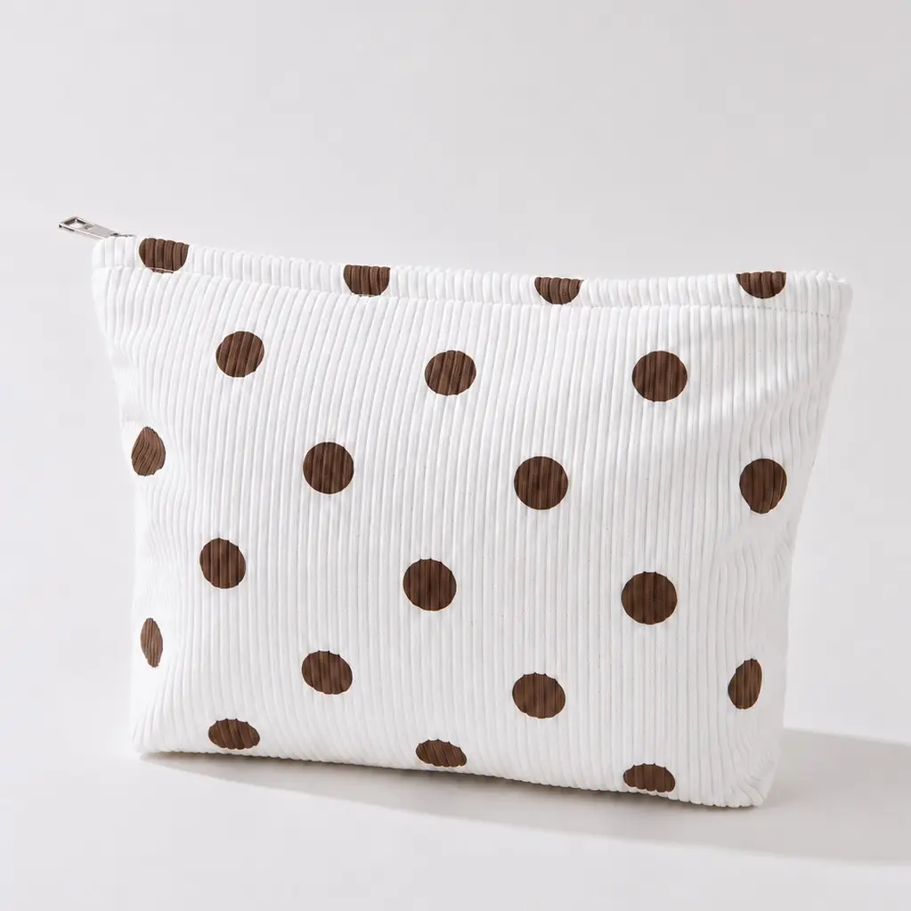 Cream ribbed makeup bag with brown polka dots